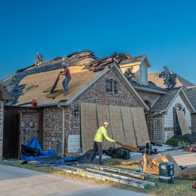 pexels-photo-33404981-33404981 Workers engage in roof replacement on a brick house in Fort Worth, Texas.